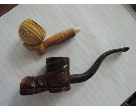 A novelty meersham pipe modelled as 'Play Up' football and leg, and a novelty pipe modelled as a boot