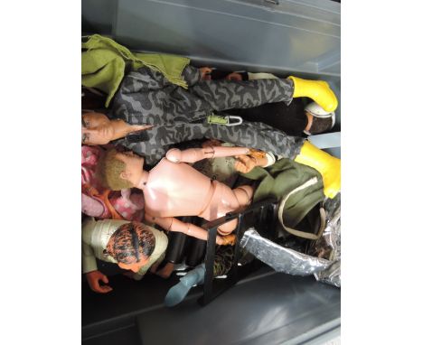 A box of Action Man figures