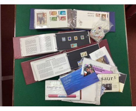 Stamps: A Collection of Over Fifty Jersey First Day Covers and over forty five mint presentation packs. Also includes a bag o