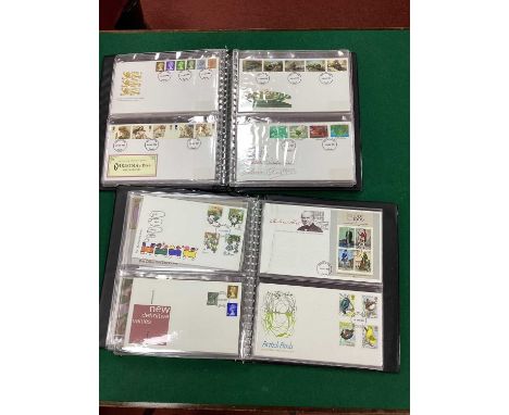 Stamps; Over 170 Great Britan First Day Covers, ranging from late pre-decimal to 1991, housed in two deluxe cover albums.