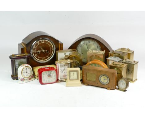 A collection of mid 20th century and later mantel clocks, carriage clocks, alarm clocks and barometers, having manual and qua