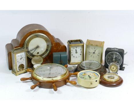 A collection of mid 20th century and later mantel clocks, carriage clocks and barometers, having manual and quartz movements.