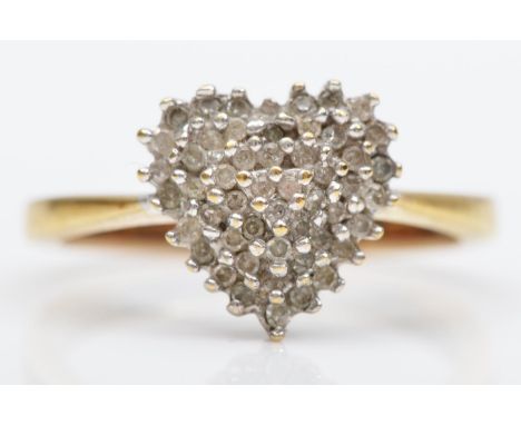 A 9ct gold and diamond set heart cluster ring, stated weight 0.25cts, M 1/2, 3gm 