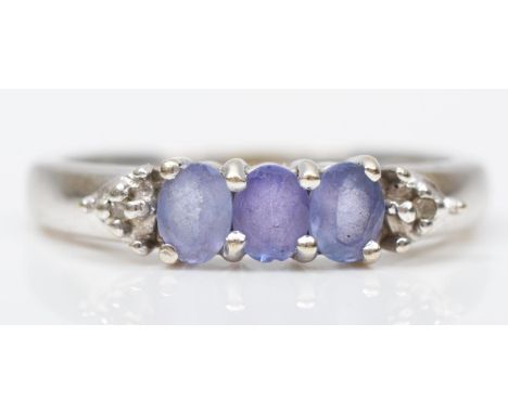 A 14K white gold tanzanite and diamond dress ring, L, 2.9gm 