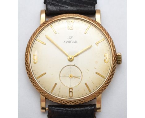 A 9ct gold gents Enicar wrist watch c1960s, having manual wind jewelled movement with black leather strap. Hallmarked for Bir