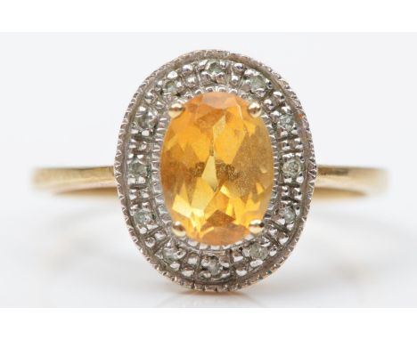 A 9ct gold citrine and diamond oval cluster ring, M, 2.2gm 