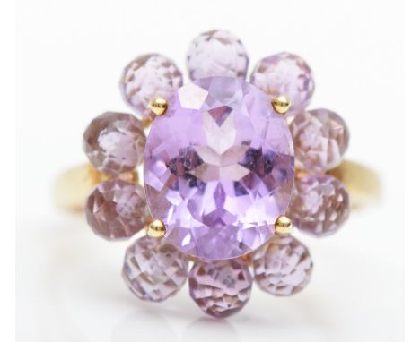 A 9ct gold and amethyst cluster ring, 18mm diameter, R, 4.1gm 