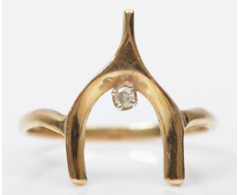 A 14K gold and brilliant cut diamond wishbone ring, K, 1.3gm 