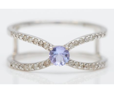 A 9ct white gold tanzanite and diamond openwork ring, N 1/2, 2.2gm 