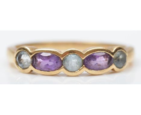 A 9ct gold amethyst and topaz five stone ring, R, 2.2gm. 