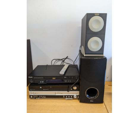 A Wharfdale DVD24F DVD player, together with a Pacific DVD player and a Panasonic DVD player, with an LG speaker and an Altec