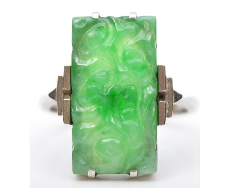 An Art Deco 9ct white gold and carved jadeite panel ring, 19 x 11mm, N, 3.7gm. 