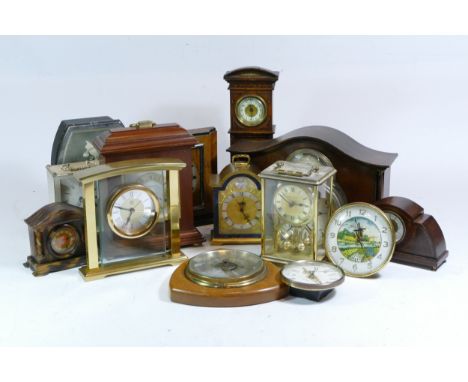 A collection of mid 20th century and later mantel clocks, carriage clocks and barometers, having manual and quartz movements.