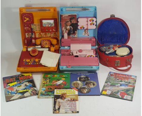 A collection of 1970s/80s childrens annuals, weekly football handbooks and toys to include Tonka diggers, a Petite sewing mac