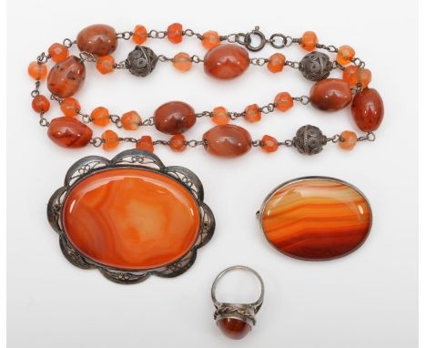 A silver mounted agate necklace, 2 silver and agate brooches and a ring, 100g. 