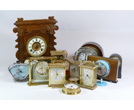 A collection of mid 20th century and later mantel clocks, carriage clocks, alarm clocks and barometers, having manual and qua