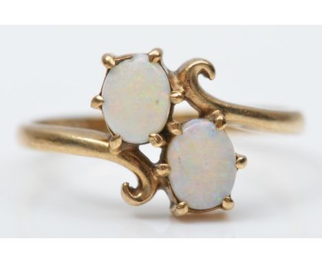 A vintage 9ct gold and two stone opal crossover ring, I, 1.4gm 