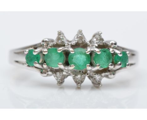 A 14K white gold emerald and diamond dress ring, L, 2.5gm 