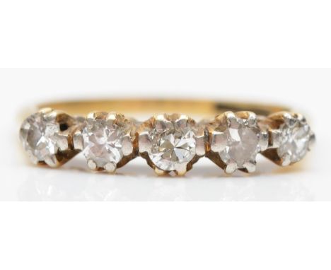 An 18ct gold five stone brilliant cut diamond ring, claw set, stated weight 0.22cts, I 1/2, 2.3gm 