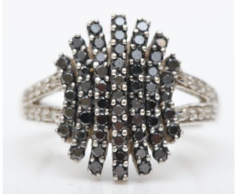 A 9ct white gold brilliant cut diamond and black stone ring, N, 5.4gm 