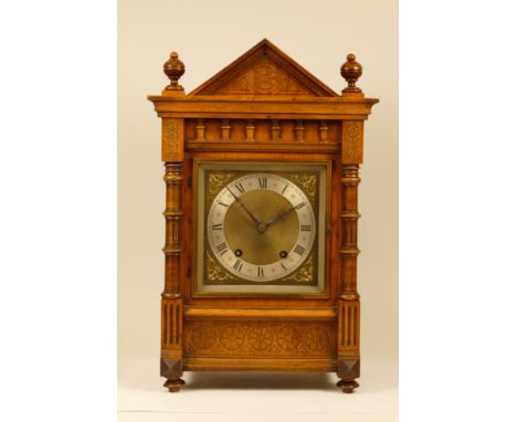 An early 20th century mahogany cased mantel clock, having architectural pediment with corinthium capped fluted front and side