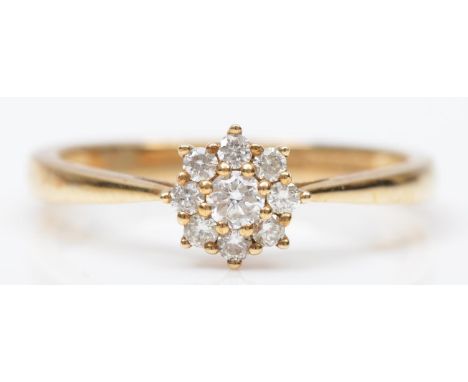 A 9ct gold and brilliant cut diamond cluster ring, stated weight 0.25cts,P 1/2, 2gm 