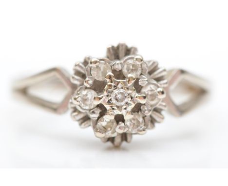 An 18ct white gold and brilliant cut diamond cluster ring, Birmingham 1979, N, 3.5gm 