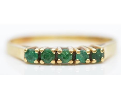 A 14K gold five stone emerald ring, L 1/2, 1.7gm 