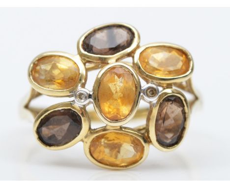 A 9ct gold citrine and smokey quartz ring, R, 2.8gm 