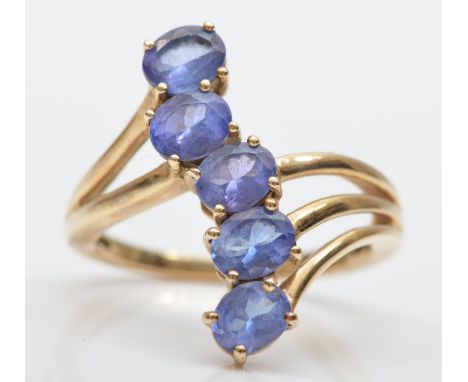 A 9ct gold and five stone tanzanite ring, L, 3gm 