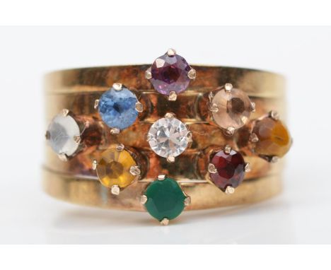 A multi gemset cluster ring, stamped 14K, including garnet, sapphire, and tigers eye, K, 4.7gm 