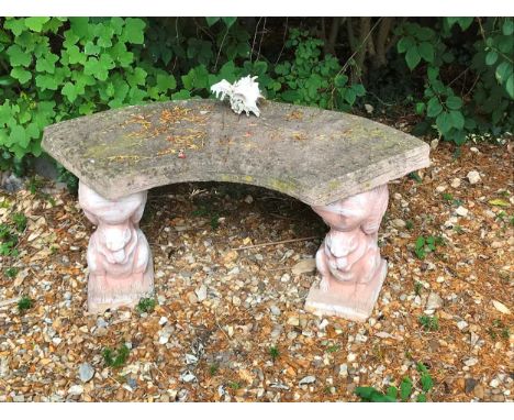 A composite stone curved garden bench with squirrel supports47 x 101 x 44cm