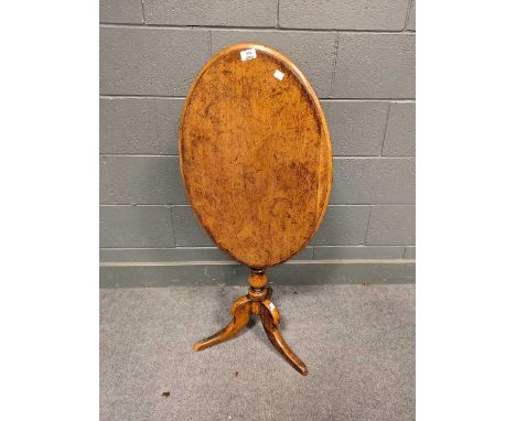 A 19th century continental walnut occasional table with oval hinged top over a bobbin turned support, 70.5 x 68 x 46.5cm