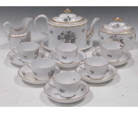 A Spode tea service circa, 1805-10, decorated with scattered flower sprigs in grey; together with a pair of Rockingham shaped