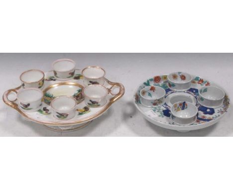 A rare Spode egg cup stand and cups circa 1820 in the Imari palette; and another. (2)Spode stand in good condition, one egg c