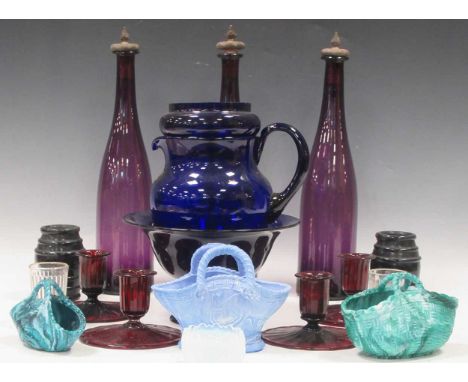 A mixed group of glassware: blue Bristol vase and jug etc; Victorian vitro-porcelain pressed baskets; four amethyst candlesta