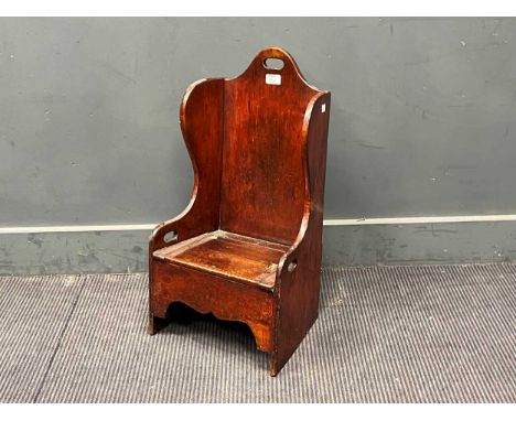 A 19th century mahogany porter's style chair made for a child, with lift up seat for a commode. 66cm H x 36cm W