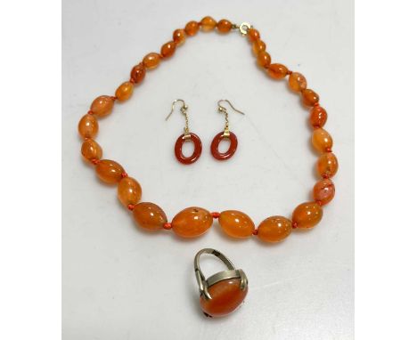 A pair of cornelian earrings, together with a cornelian bead necklace and ring (3)