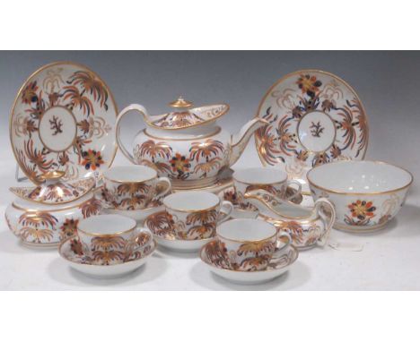 A New Hall tea service circa, circa 1800-10, decorated with date palms and floral motifs in imari colours, comprising a teapo