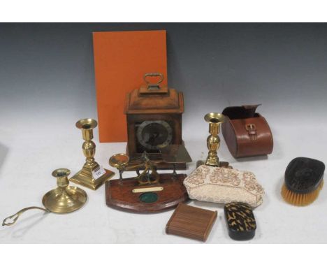 An 18th century style walnut bracket clock by Garrard, a set of postal scales, a pair of brass candlesticks, a beaded evening
