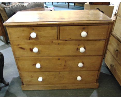 A PINE CHEST OF TWO SHORT AND THREE LONG DRAWERS  on plinth base with ceramic handles, 90cm wide 45cm deep 99cm high