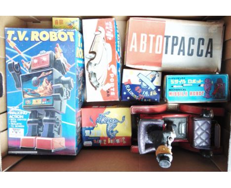 ASSORTED TINPLATE AND OTHER TOYS  comprising a Japanese battery-operated veteran car, unboxed; U.S.S.R. clockwork bus diorama