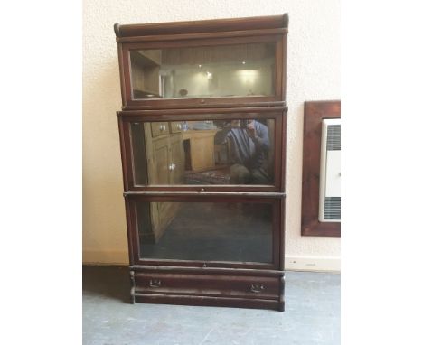 A THREE TIER MAHOGANY GLOBE WERNICKE BOOKCASE  with drawer to base, 79cm wide 35cm deep 138cm high