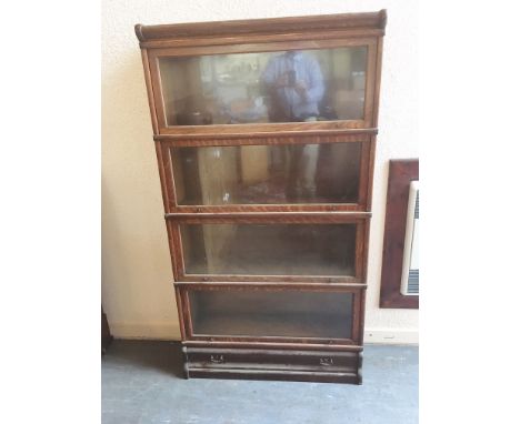 A FOUR TIER OAK GLOBE WERNICK BOOKCASE  with drawer to base 87cm wide 27cm deep 158cm high