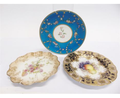 THREE CABINET PLATES  including a Royal Worcester example with painted floral decoration by Richard Sebright, signed, 23cm di