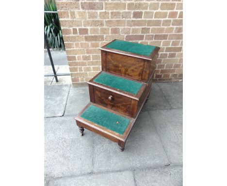 A VICTORIAN FIGURED MAHOGANY TWO TREAD LIBRARY STEP COMMODE  on turned supports, 48cm wide 75cm deep 69cm high
