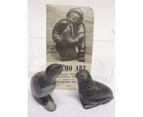 TWO INUIT CARVED STONE FIGURES OF ANIMALS  signed to base, the taller 9.5cm high Sold with a leaflet from the Canadian Handic