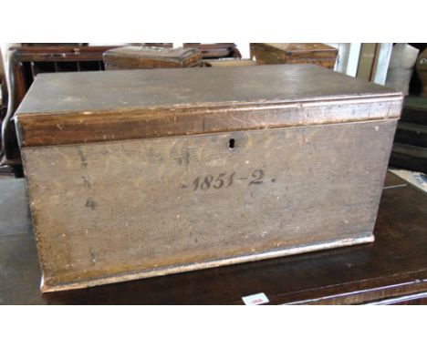 A VICTORIAN PINE TRUNK  with scumbled decoration, carrying handles to each end and painted date to front '1851-2', 61cm wide 