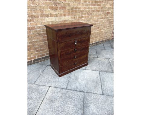 A CONTINENTAL COMMODE WASHSTAND  the top opening to marble lined interior, above four drawers, 82cm wide 49cm deep 95cm high