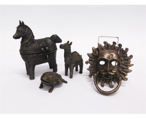 THREE BENIN STYLE METAL FIGURES  of stylised animals, together with a decorative brass door knocker
